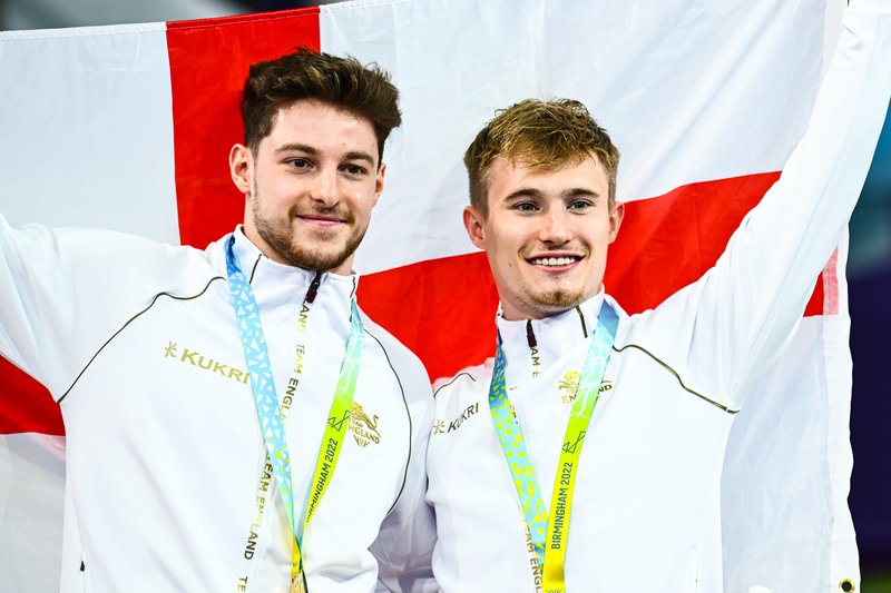 Anthony Harding Jack Laugher GOLD medal and flag Birmingham 2022.jpg